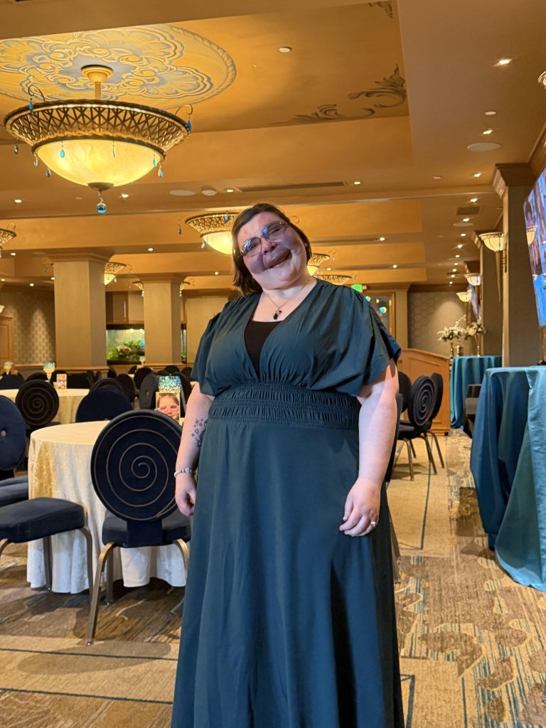 A photograph of Kaelin Ball in a ballroom.